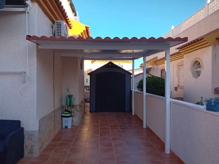 Custom roof cover panels in textured finish, matching home aesthetics.