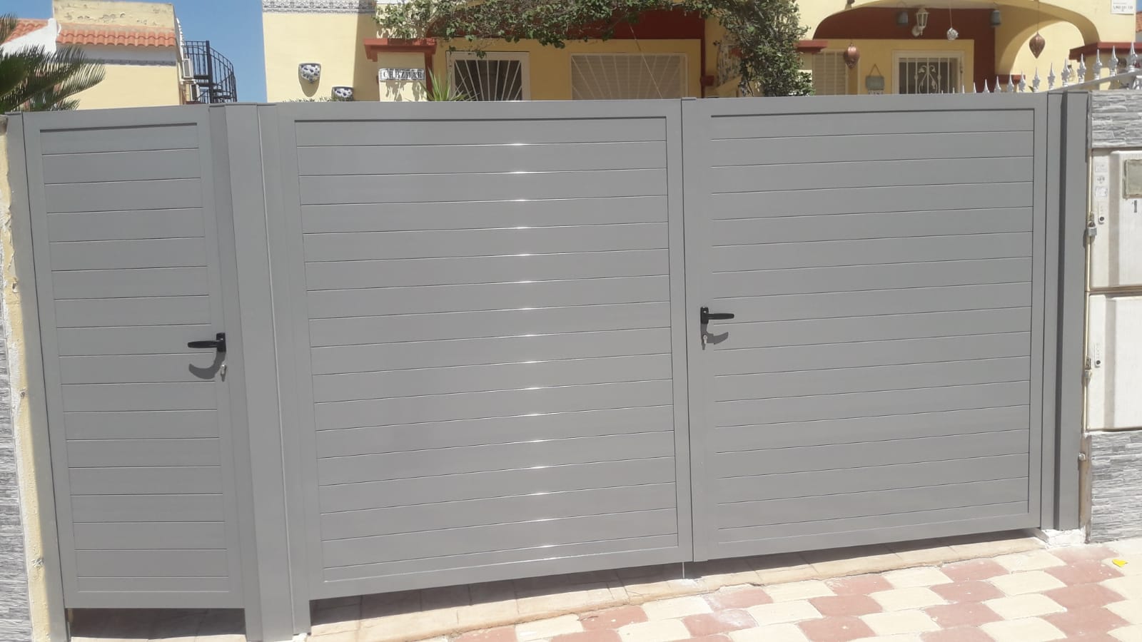 silver aluminium driveway gate in Orihuela Costa