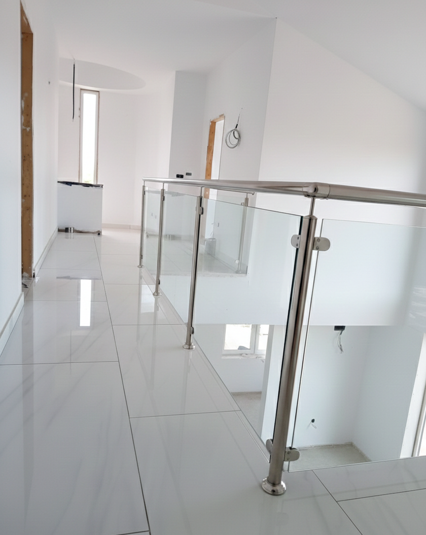 Aluminium and glass balcony railing system for contemporary open-plan home design.