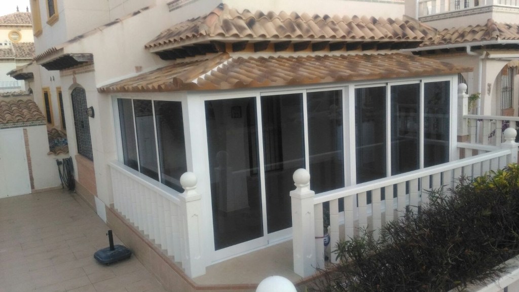 White conservatory with tinted glass sliding doors in Orihuela Costa, Costa Blanca