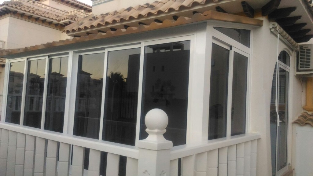 Aluminium conservatory with tinted glass panels in Orihuela Costa near Torrevieja, Costa Blanca
